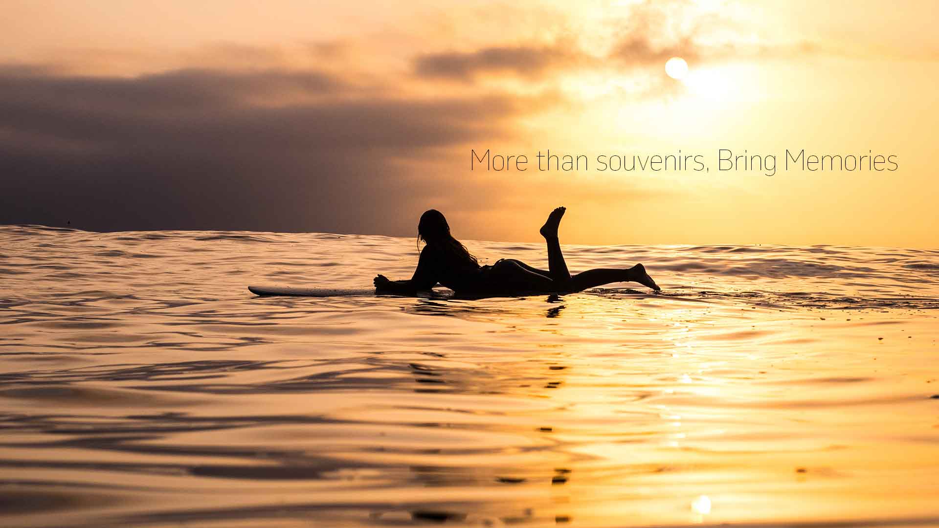 A surf er girl in a sunset view in the ocean